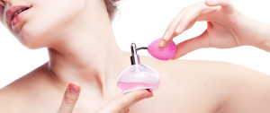 woman-with-perfume-spray-711x300
