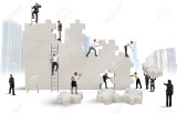 31364187-Business-team-Builds-a-new-company-with-puzzle-Stock-Photo