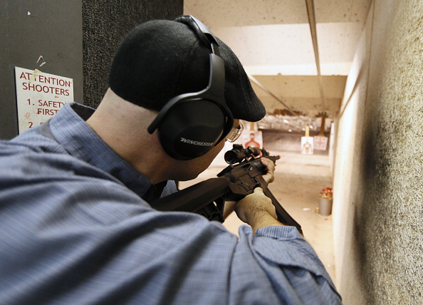 Firearms Enthusiasts Practice Shooting At Gun Range